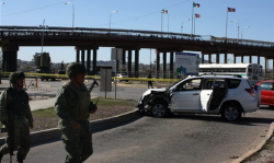 A U.S. consulate employee and her husband were shot to death Saturday in their car near the Santa Fe International bridge linking Ciudad Juarez with El Paso, Texas. (AP Photo)